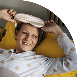 Woman putting on eye mask for self-care